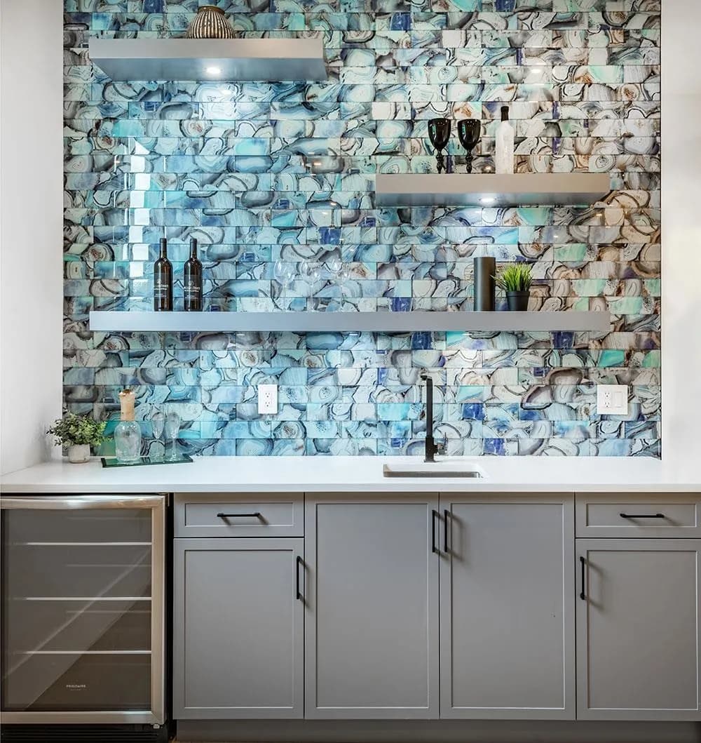 Wet bar with blue glass mosaic backsplash and grey cabinetry in the theatre room of a Crescent Beach custom home, South Surrey BC