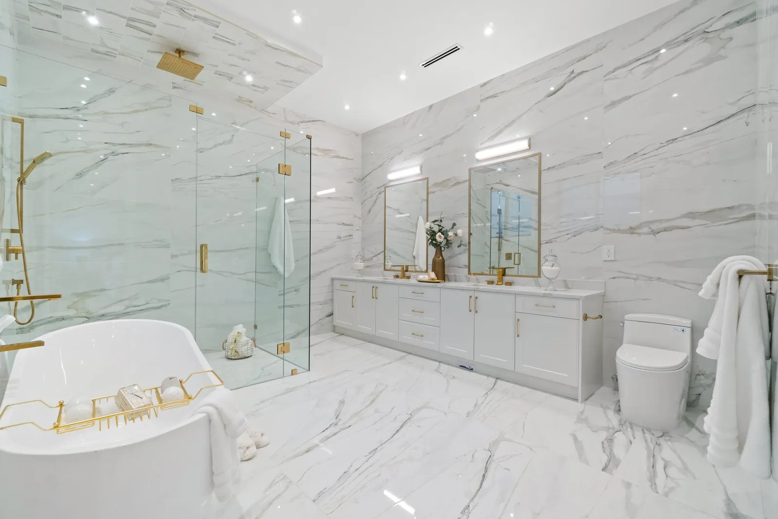 Primary ensuite with freestanding tub, marble-look tile and glass shower in a Crescent Beach custom home, South Surrey BC