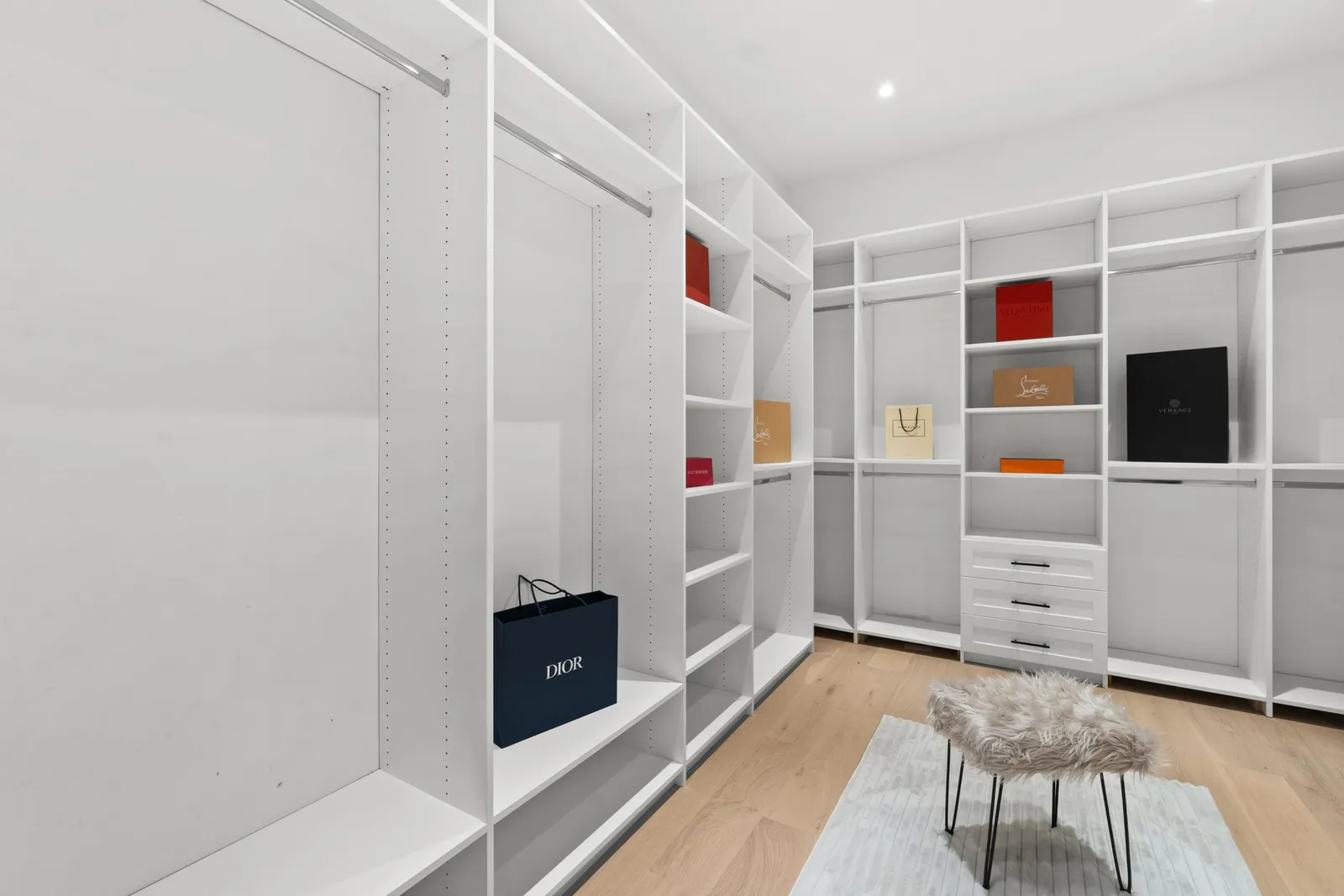 Custom walk-in closet millwork in the primary suite at 12686 25 Avenue, Crescent Beach, South Surrey